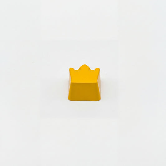 Sculpted royal custom keycap yellow die-cast metal lacquer finish front view on white background