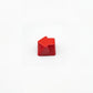 Sculpted arrow custom keycap crimson red die-cast metal smooth lacquer top view on white background