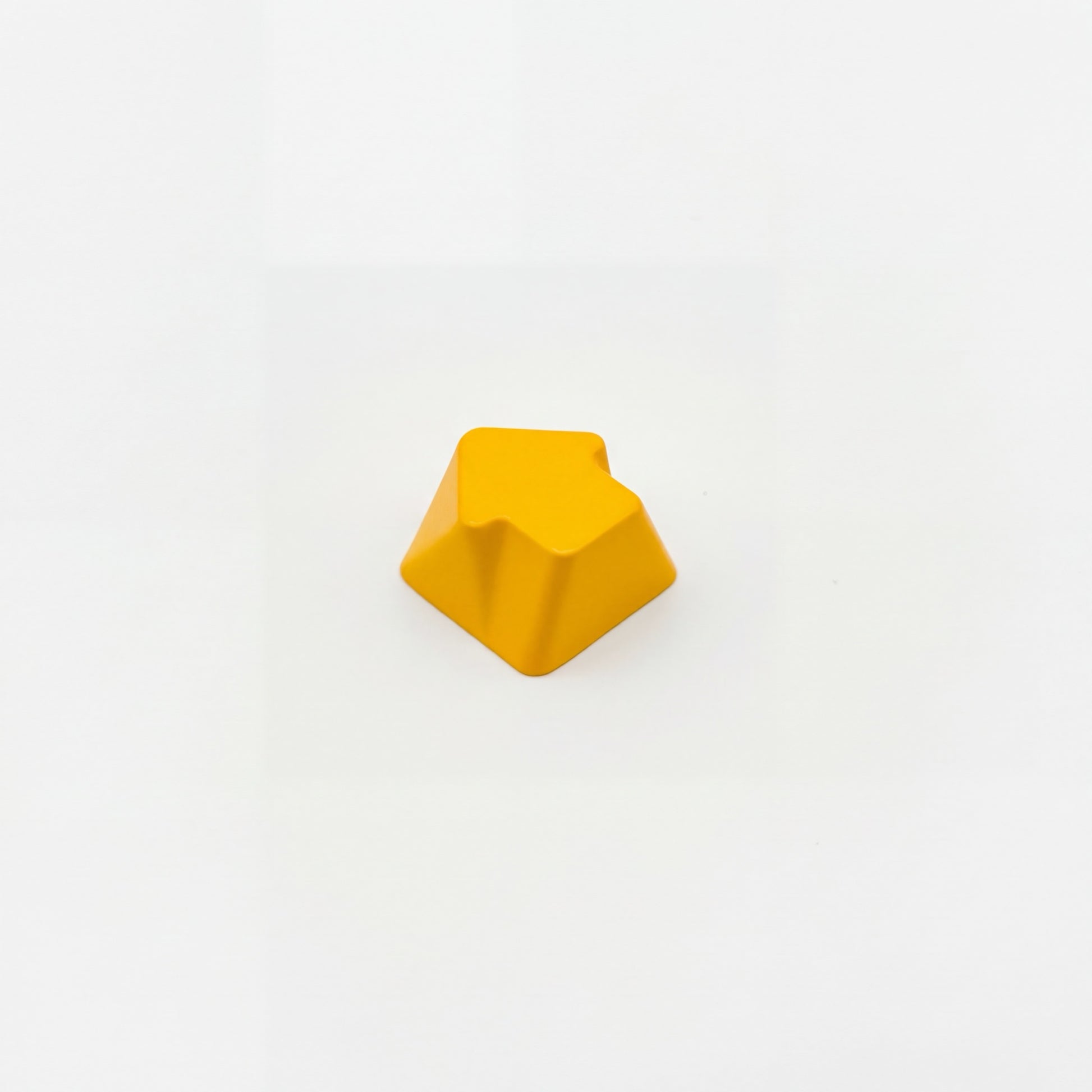 Arrow novelty keycap golden yellow side profile showing 3D relief sculpted arrow zinc alloy