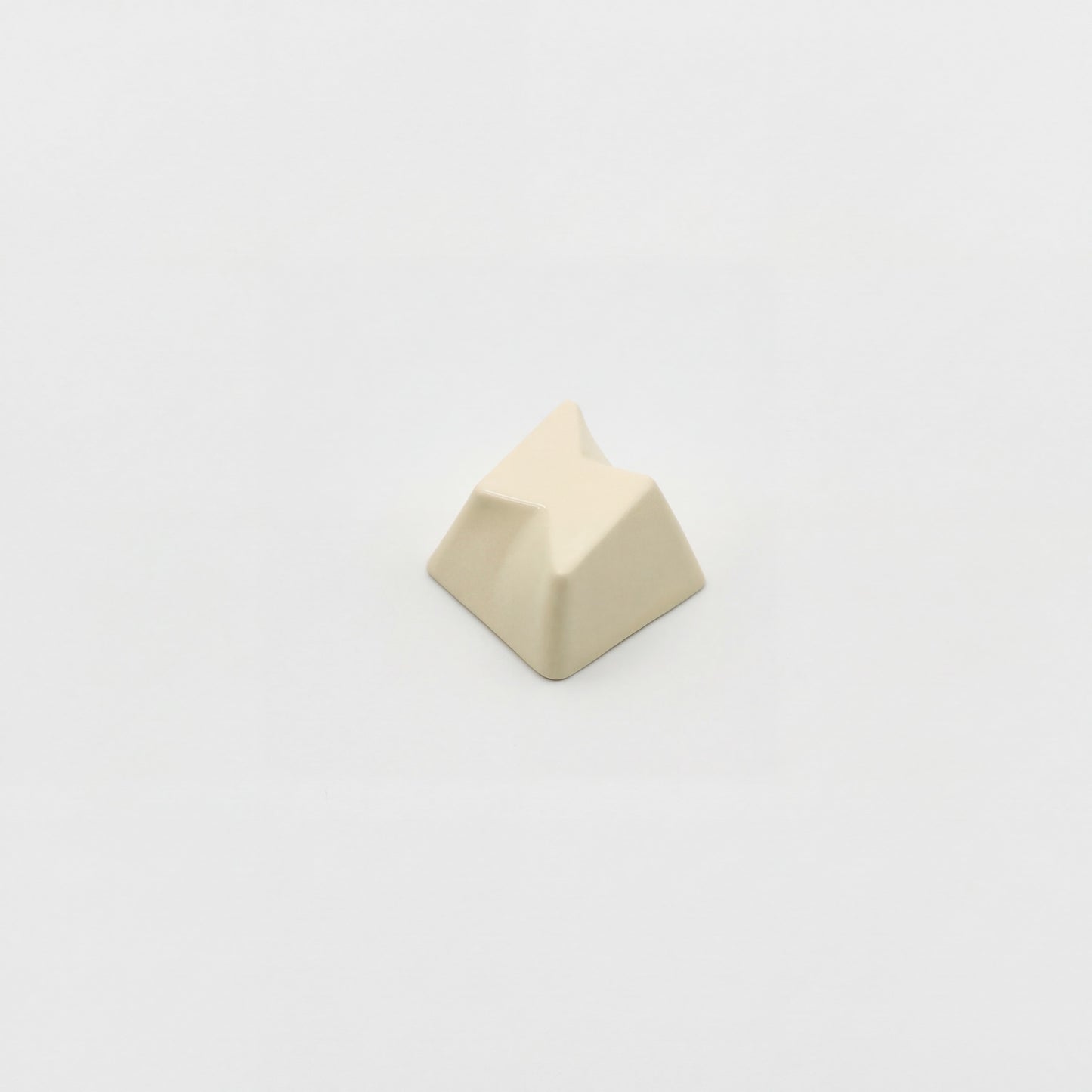 Minimalist bolt novelty keycap cream white side view showing 3D faceted lightning relief zinc alloy