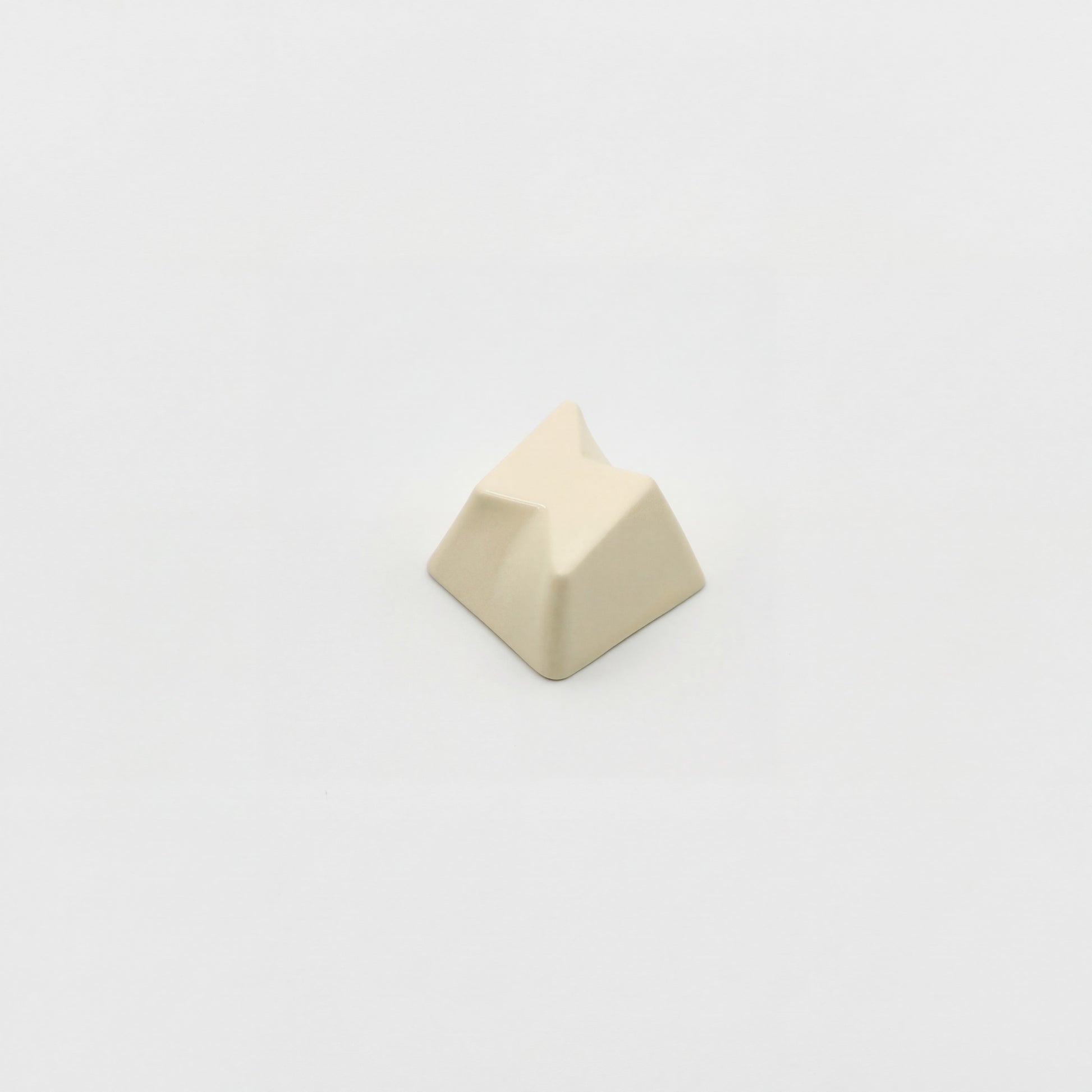 Minimalist bolt novelty keycap cream white side view showing 3D faceted lightning relief zinc alloy