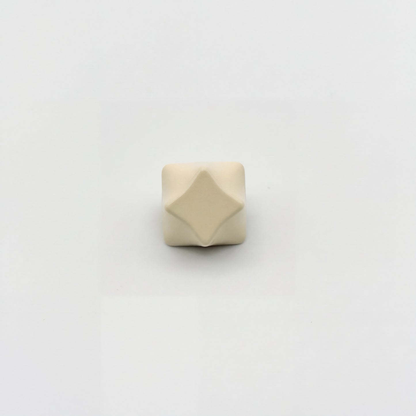 Four-point star artisan keycap cream white zinc alloy sculpted 3D relief angle view