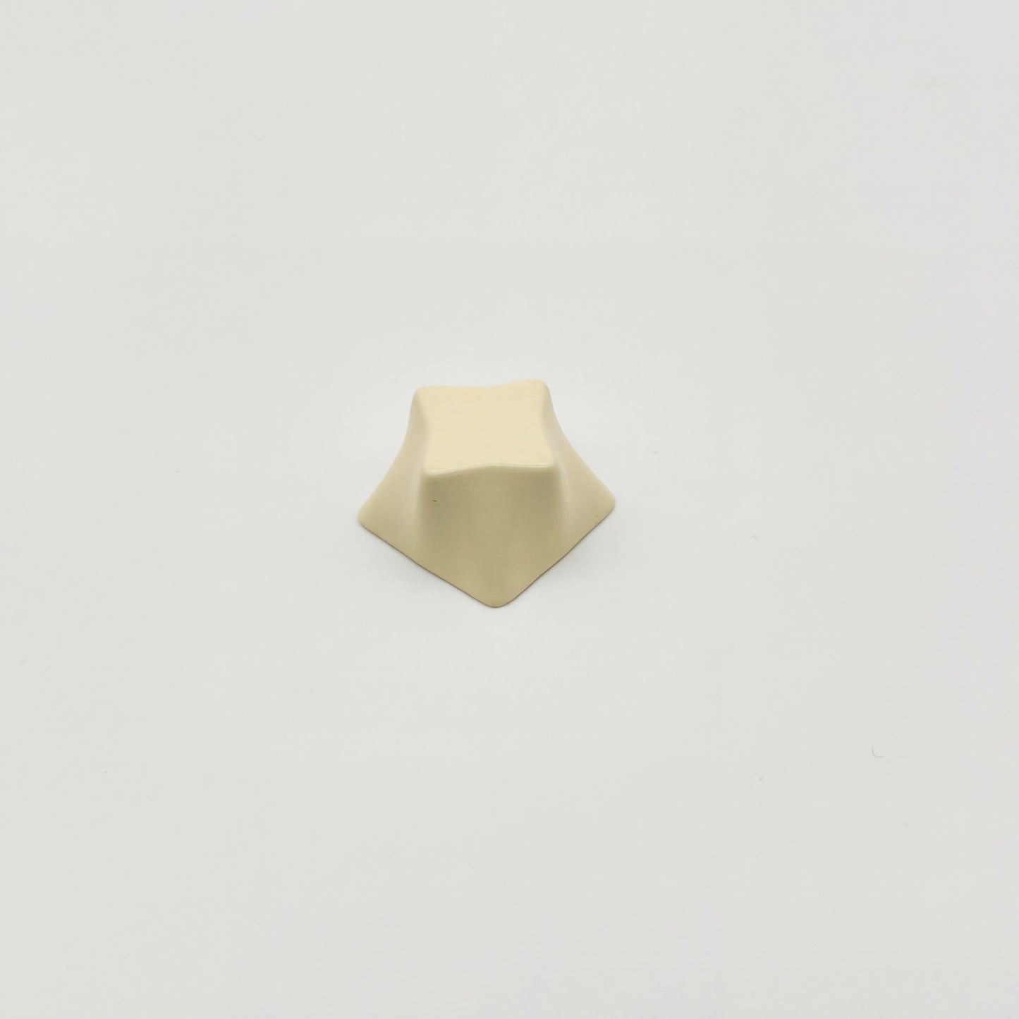 Geometric star novelty keycap cream white side view showing four-point star profile zinc alloy