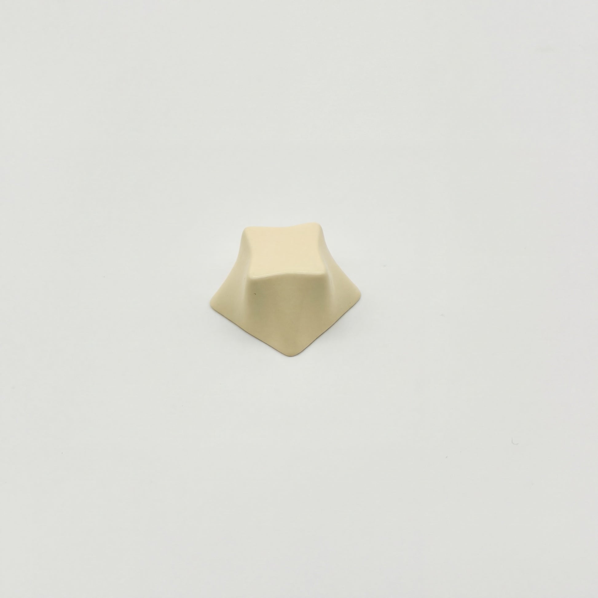 Geometric star novelty keycap cream white side view showing four-point star profile zinc alloy