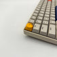 Lunar artisan keycap golden yellow on mechanical keyboard side view sculpted moon detail