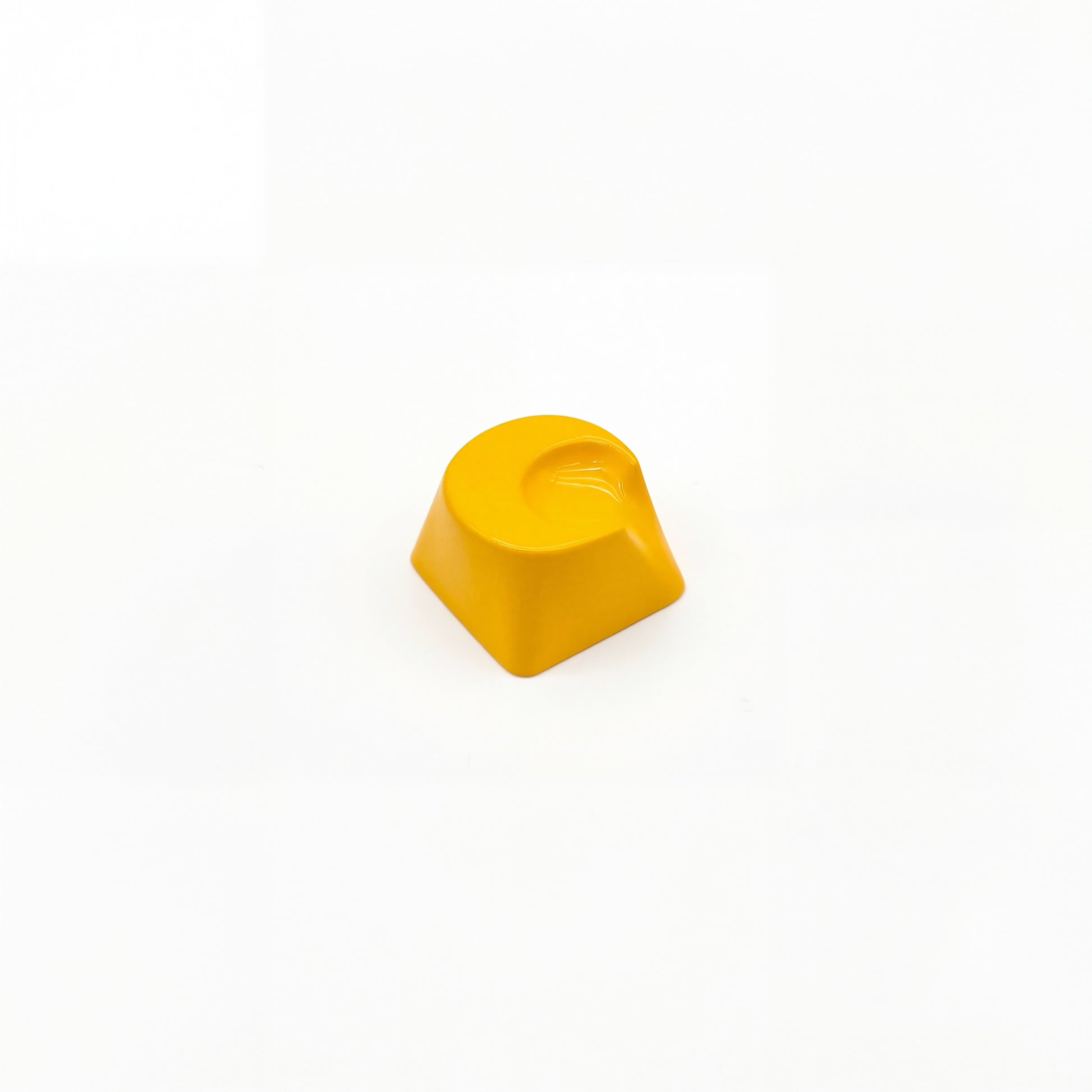 Lunar novelty keycap golden yellow side view showing 3D crescent moon relief and smooth surface