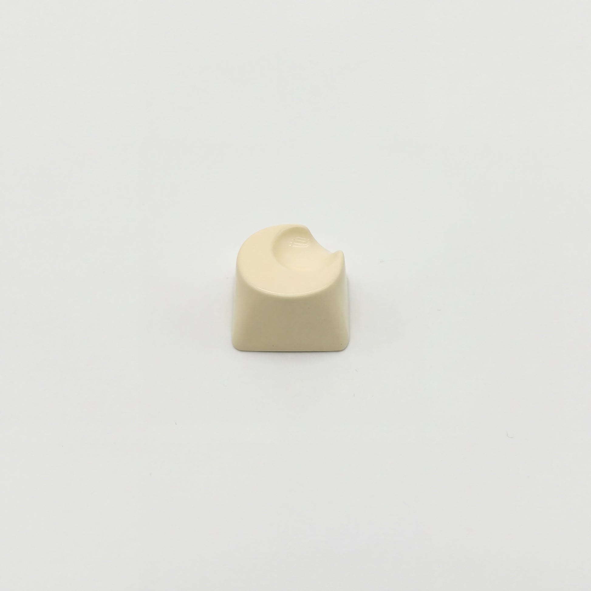 Sculpted moon custom keycap cream white smooth high gloss finish front view on white background