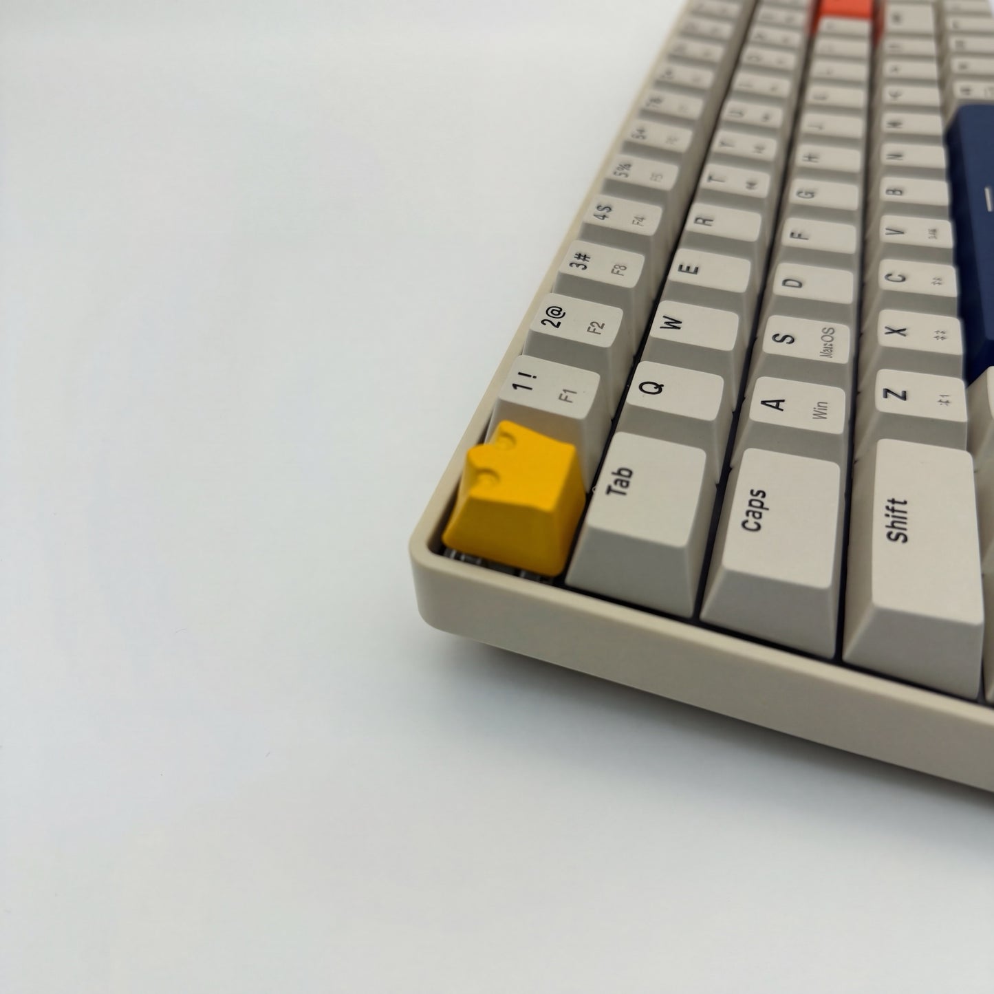 Royal artisan keycap yellow zinc alloy on mechanical keyboard side view showing crown profile detail