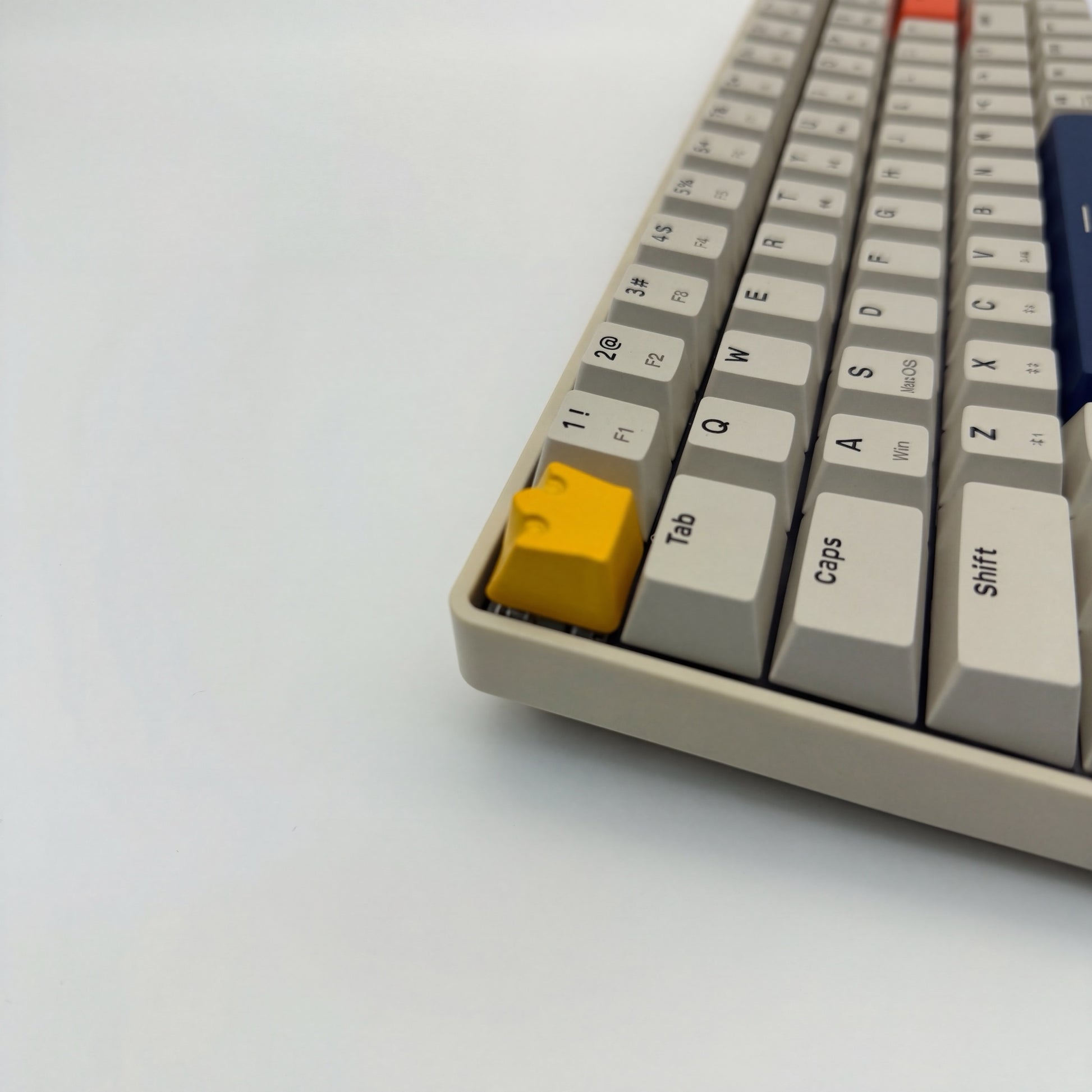 Royal artisan keycap yellow zinc alloy on mechanical keyboard side view showing crown profile detail