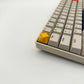 Minimalist star keycap golden yellow installed on ESC key mechanical keyboard side view