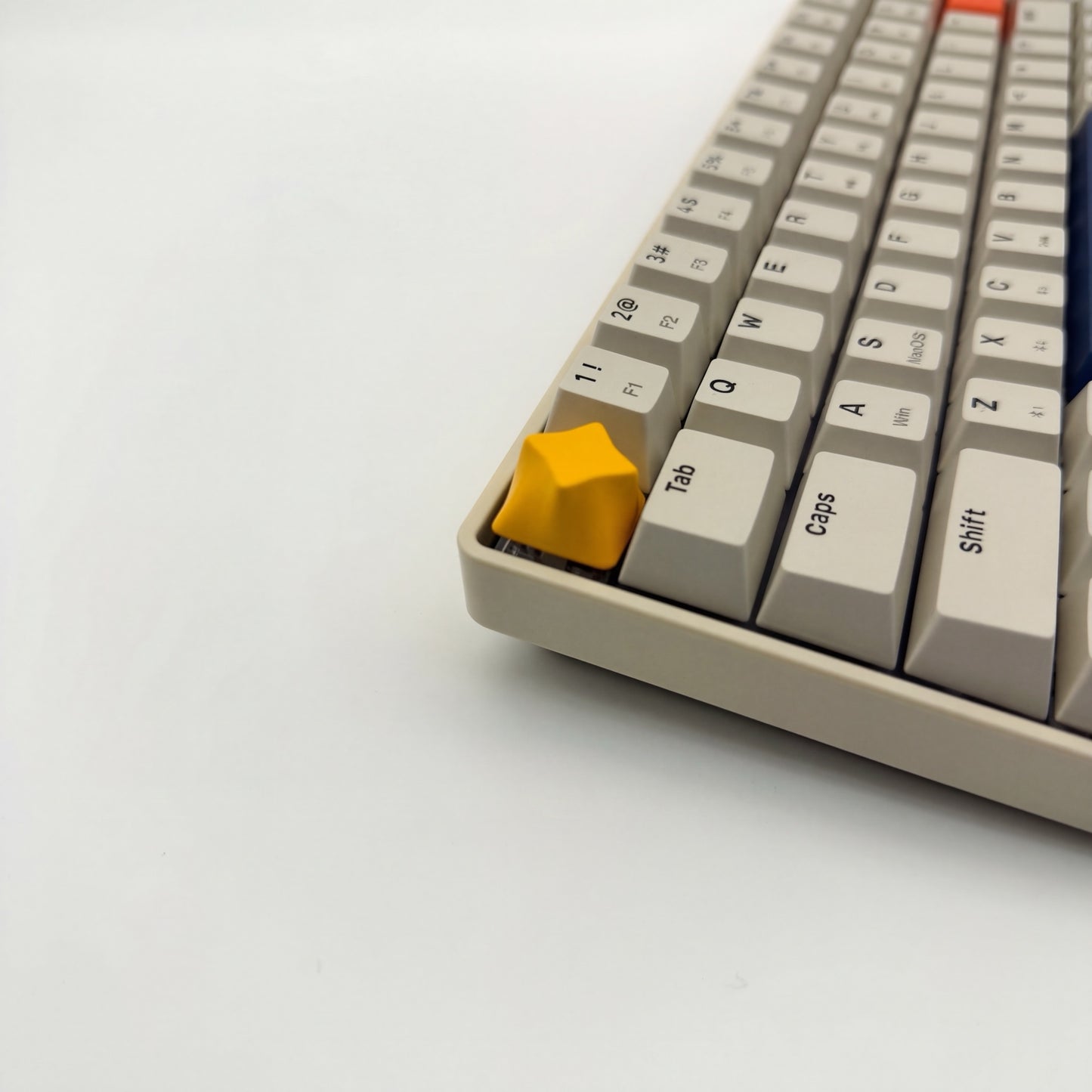 Minimalist star keycap golden yellow installed on ESC key mechanical keyboard side view