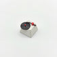 Retro turntable novelty keycap side view ABS body with black vinyl disc and red accents